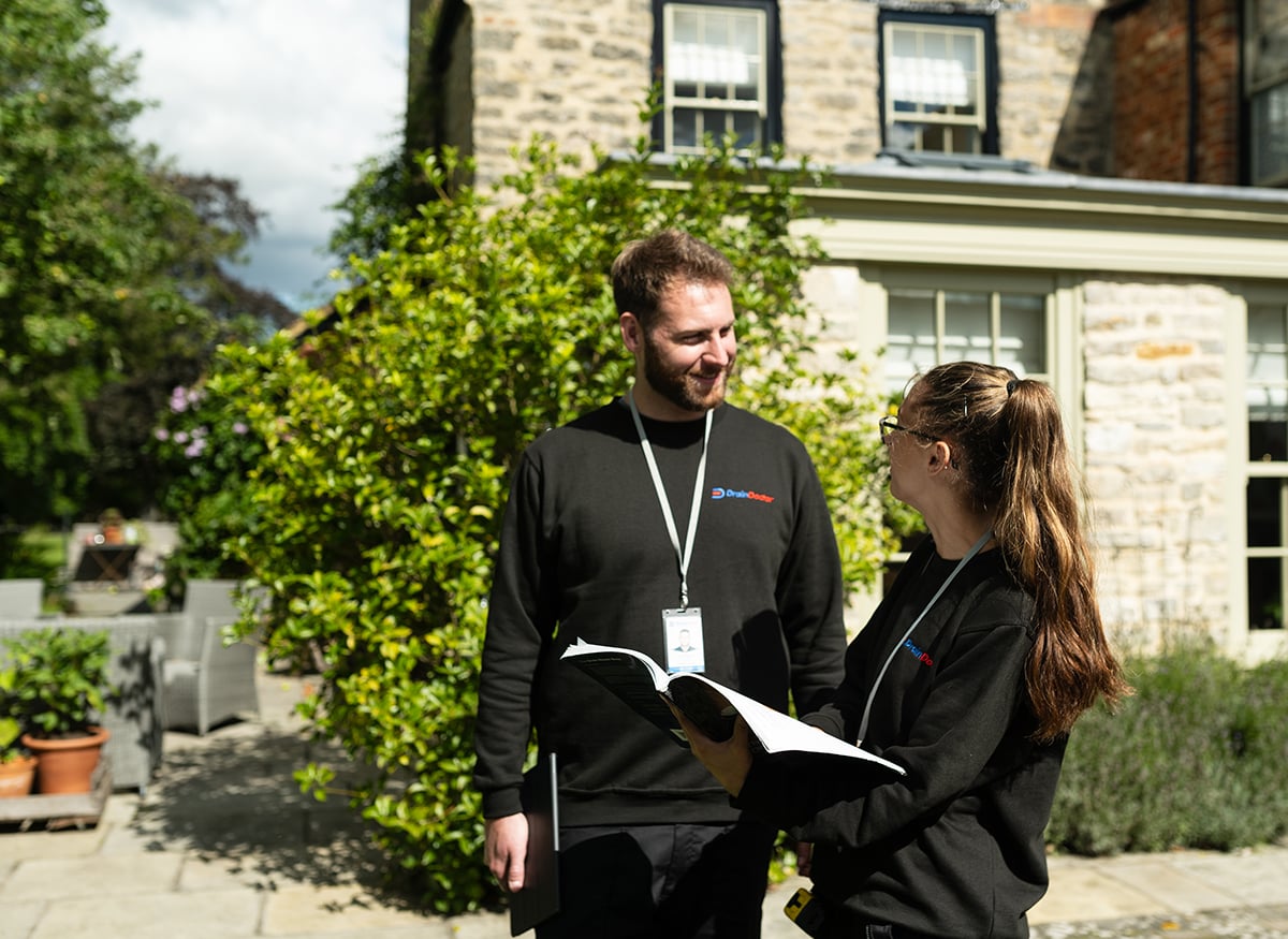 Drain Doctor engineers discussing compliance report