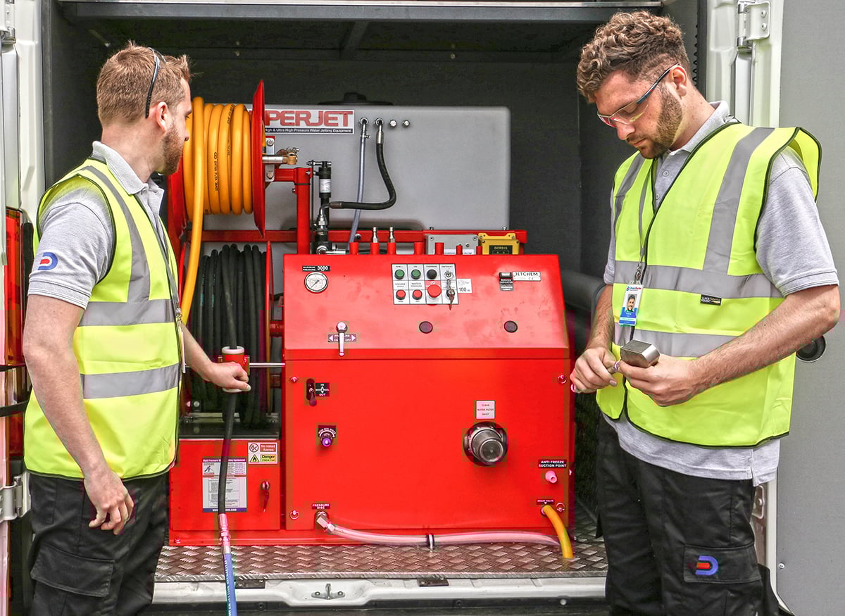 Drain Doctor engineers setting up jetter