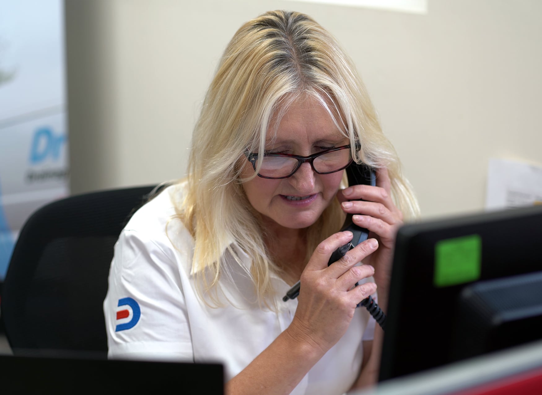 Drain Doctor team member on a call with a customer