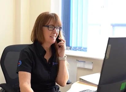 Picture of a Drain Doctor team member on the phone