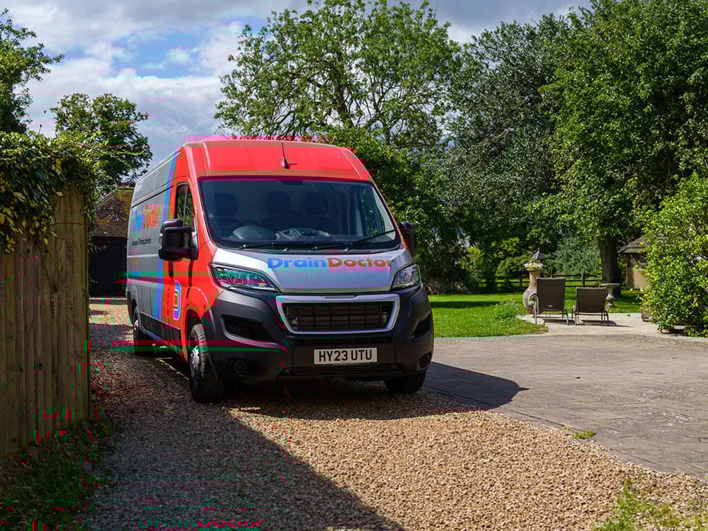 Drain Doctor van outside clients house