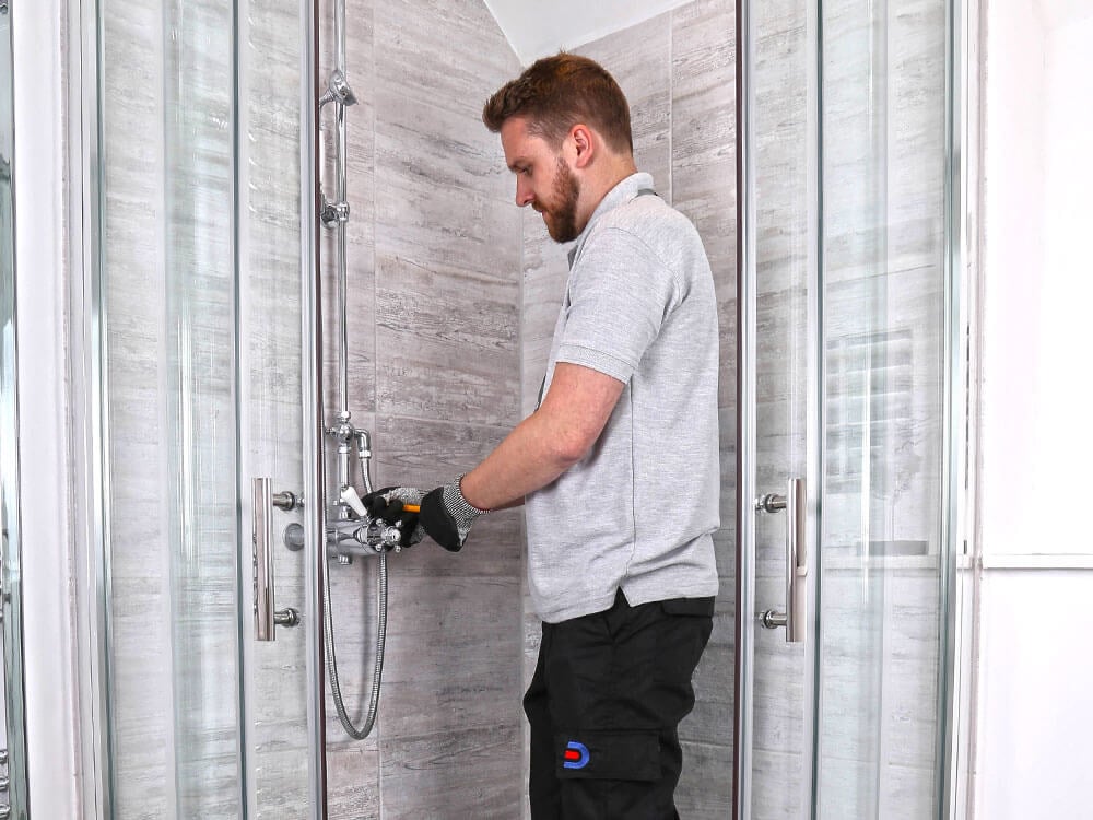 Drain Doctor engineer fixing a shower