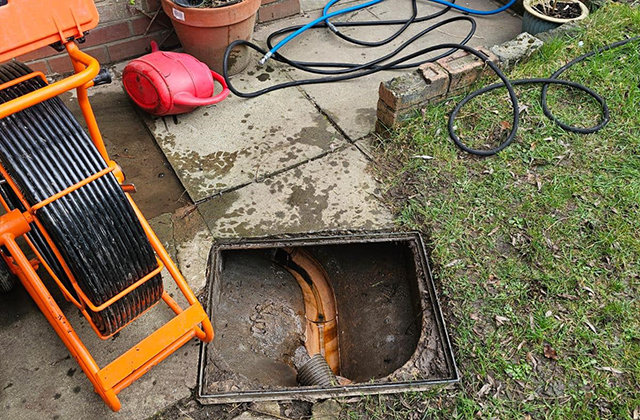 blocked drain with drainage equipment